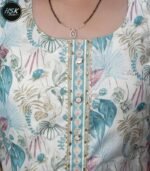 Elevate your ethnic wardrobe with this stunning three-piece kurti set featuring a mesmerising tropical floral print in serene turquoise and white hues. The sleeveless kurti showcases an exquisite design with delicate golden embellishments along the centre panel, complemented by decorative buttons and intricate detailing. The matching pants feature a coordinated turquoise pattern, while the solid turquoise dupatta completes the ensemble perfectly. The cotton fabric ensures comfort and breathability, making it ideal for various occasions. The kurti's sophisticated neckline is enhanced with a decorative trim, and the overall silhouette offers a flattering fit. This versatile set can be styled with traditional jewellery for festivities or worn with minimal accessories for a contemporary look. The combination of classic design elements with modern aesthetics makes this outfit a must-have addition to your wardrobe.