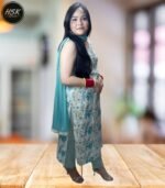 Elevate your ethnic wardrobe with this stunning three-piece kurti set featuring a mesmerising tropical floral print in serene turquoise and white hues. The sleeveless kurti showcases an exquisite design with delicate golden embellishments along the centre panel, complemented by decorative buttons and intricate detailing. The matching pants feature a coordinated turquoise pattern, while the solid turquoise dupatta completes the ensemble perfectly. The cotton fabric ensures comfort and breathability, making it ideal for various occasions. The kurti's sophisticated neckline is enhanced with a decorative trim, and the overall silhouette offers a flattering fit. This versatile set can be styled with traditional jewellery for festivities or worn with minimal accessories for a contemporary look. The combination of classic design elements with modern aesthetics makes this outfit a must-have addition to your wardrobe.