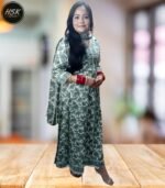 Elevate your ethnic wardrobe with this stunning full-length kurti dress in a sophisticated green and white floral print. The dress features exquisite white lace detailing along the V-neckline, creating an elegant contrast against the verdant floral pattern. The full-length silhouette offers graceful movement, while the long sleeves with gathered cuffs add a touch of vintage charm. The traditional design is beautifully modernised with intricate geometric patterns adorning the neckline and hem. Crafted with attention to detail, this kurti dress combines comfort with style, making it perfect for festive occasions or formal events. The white base with sage green floral motifs creates a fresh, timeless appeal. The dress includes delicate embellishments and can be paired with matching bottoms for a complete ensemble. The flowing silhouette ensures comfort throughout the day while maintaining a sophisticated appearance.